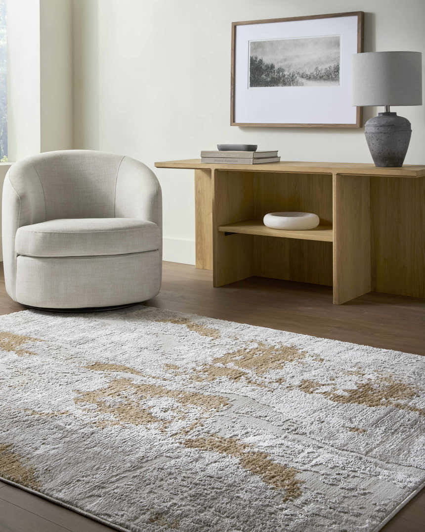 Living room scene with neutral swivel chair and Chroma Area Rug in ivory, light gray, and mustard. Roomscene-Rectangle