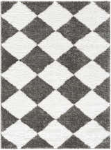 Close-up of the Celine Area Rug, a shag rug with a charcoal and cream diamond pattern. Design-Rectangle-537