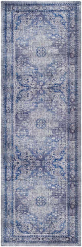 Close-up of the Csilla Area Rug. Hand-tufted polyester rug in arctic sky, blue, ivory, and slate blue with a traditional pattern. Design-Runner-268