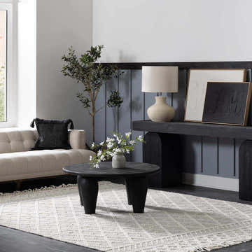 Living room scene with ivory Cromford Cotton&Wool Boutique Rug, sofa, black coffee table, and console table. Roomscene-Rectangle