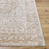 Close-up of the Cosimo Area Rug. Cream, tan, and gray traditional pattern on a machine-woven polyester rug. Front