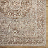 Close up of a Cosimo Area Rug showing its cream, tan, and brown traditional floral pattern and border detail. Corner