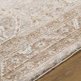 Close up of the cream and tan Cosimo Area Rug showing its traditional pattern and soft texture. Texture