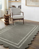 Entryway scene with a gray Chogan Stone Area Rug, neutral chair, and wood accents. Contemporary style. Roomscene-Rectangle