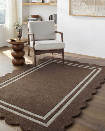 Living room scene with a Chogan Chocolate Brown area rug, modern chair, and wood side table. Roomscene-Rectangle