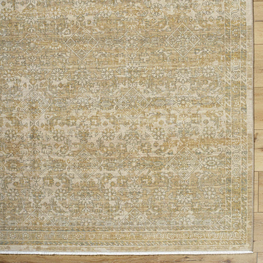 Close-up of the Becki Taupe Owens x Livabliss Renaissance Area Rug. Beige, tan, and taupe traditional wool rug. Corner