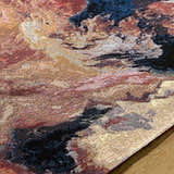 Close-up of Chemed Area Rug. Machine woven texture in charcoal, crimson, ivory, mustard, and slate gray hues. Coastal style. Texture
