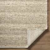 Close-up of the Ctadqe Beige Stripe Hand Woven Wool Area Rug showing texture and stripe detail. Medium brown wool on wood floor. Fold