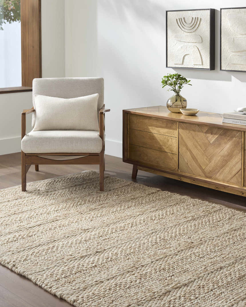 Living room scene with a Ctadqe Beige Stripe Hand Woven Wool Area Rug, chair, and wood cabinet. Farmhouse style. Roomscene-Rectangle