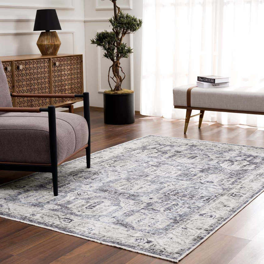 Living room scene with Off White Holi-4602 washable area rug, gray chair, wood cabinet, and neutral bench. Roomscene-Rectangle