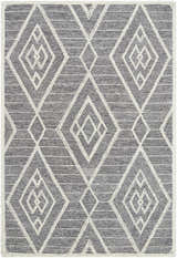 Close-up of the Ceanna Area Rug. Gray wool rug with off-white geometric diamond pattern. Hand-tufted texture. Design-Rectangle-576