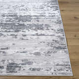 Close-up of the Candie Gray Area Rug showing its cream, ivory, and gray contemporary pattern and machine-woven texture. Front