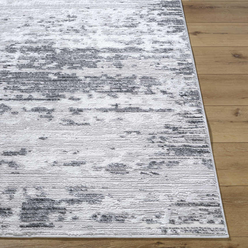 Close-up of the Candie Gray Area Rug showing its cream, ivory, and gray contemporary pattern and machine-woven texture. Front
