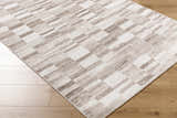 Close-up of the Cherie Light Brown Area Rug. Contemporary design with light silver, sage, and silver gray tones. Corner