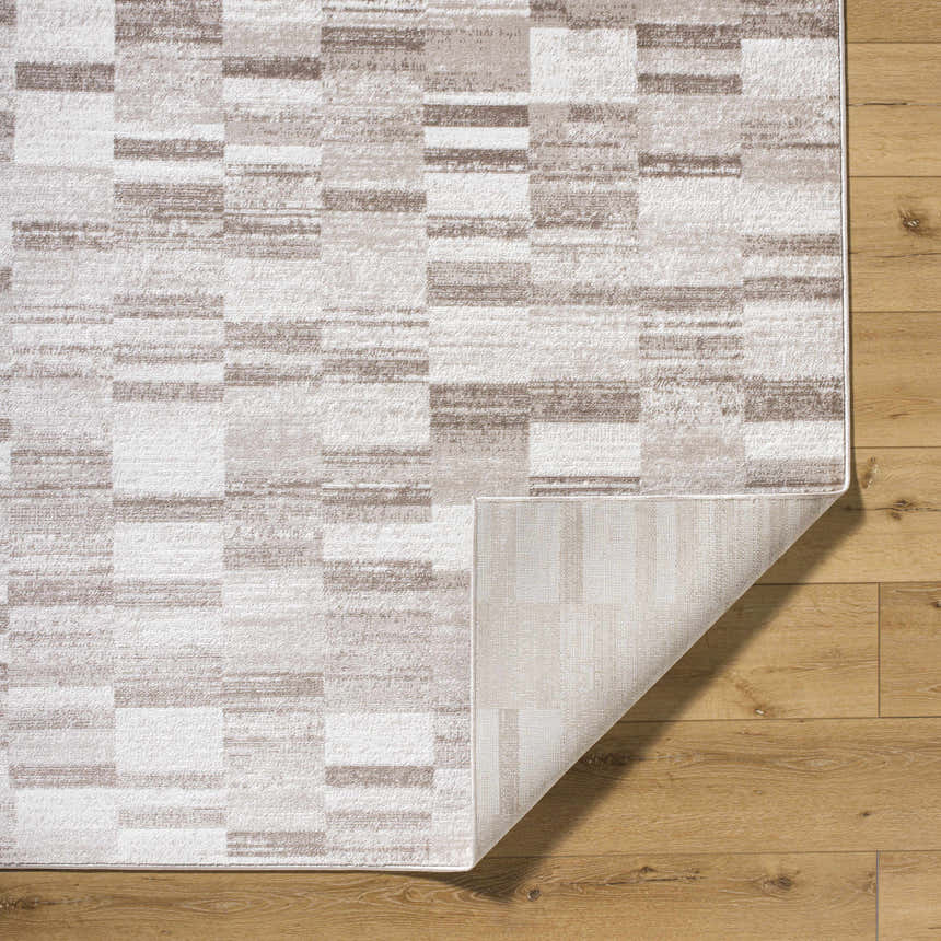 Close-up of the Cherie Light Brown Area Rug showing its contemporary block pattern and light silver, sage, and silver gray colors. Fold