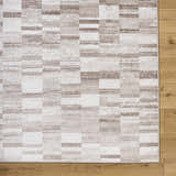 Close-up of the Cherie Light Brown Area Rug. Contemporary design with light silver, sage, and silver gray blocks. Swatch