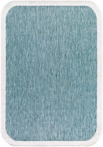 Close-up of the Chetan Light Blue Outdoor Rug. Aqua and cream textured weave with a white border. Rectangle shape. Design-Rectangle-537