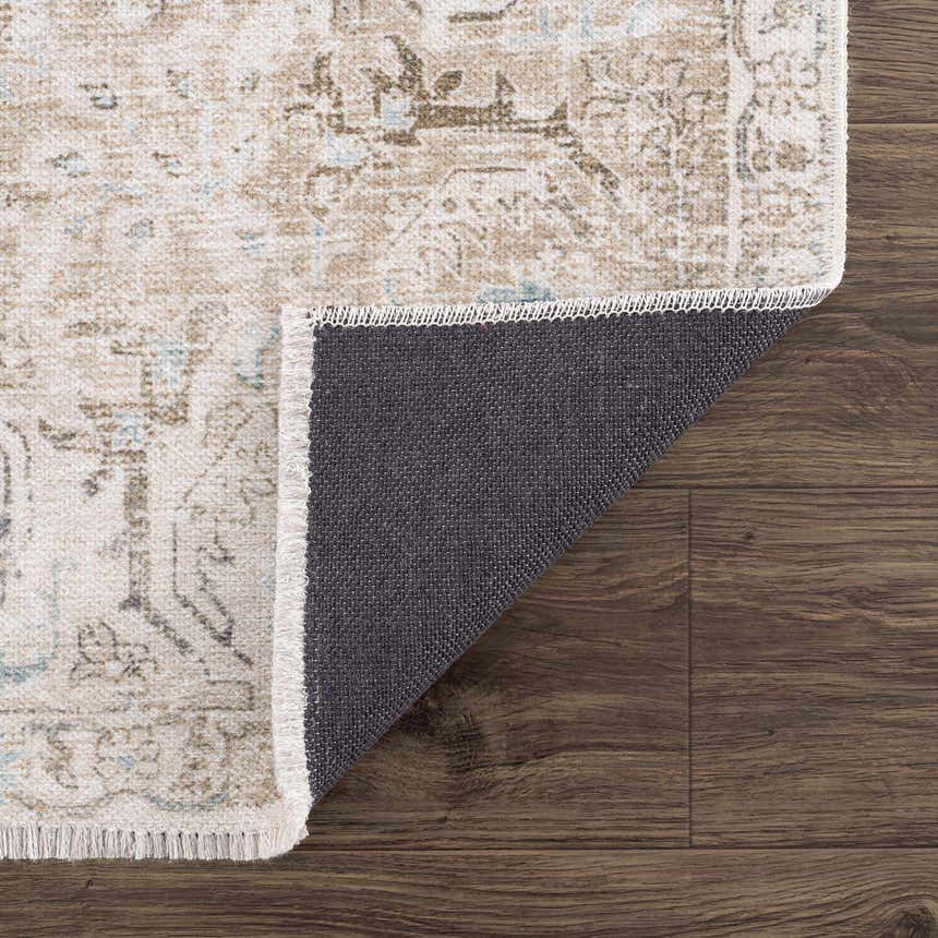 Close-up of Beige Holi-4600 Washable Area Rug showing traditional vintage pattern, cream, brown, and peach colors, and rug backing. Fold