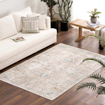 Living room scene with a Beige Holi-4600 Washable Area Rug, cream sofa, wood floor, and plants. Farmhouse style. Roomscene-Rectangle