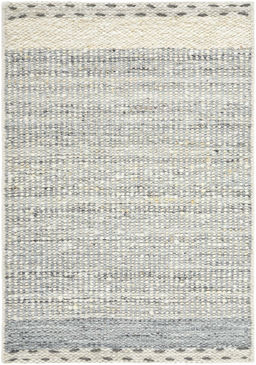 Close-up of the Dalaoig Flat Woven Wool Rug; a textured rug in charcoal, cream, and gray with a hand-woven construction. Design-Rectangle-23