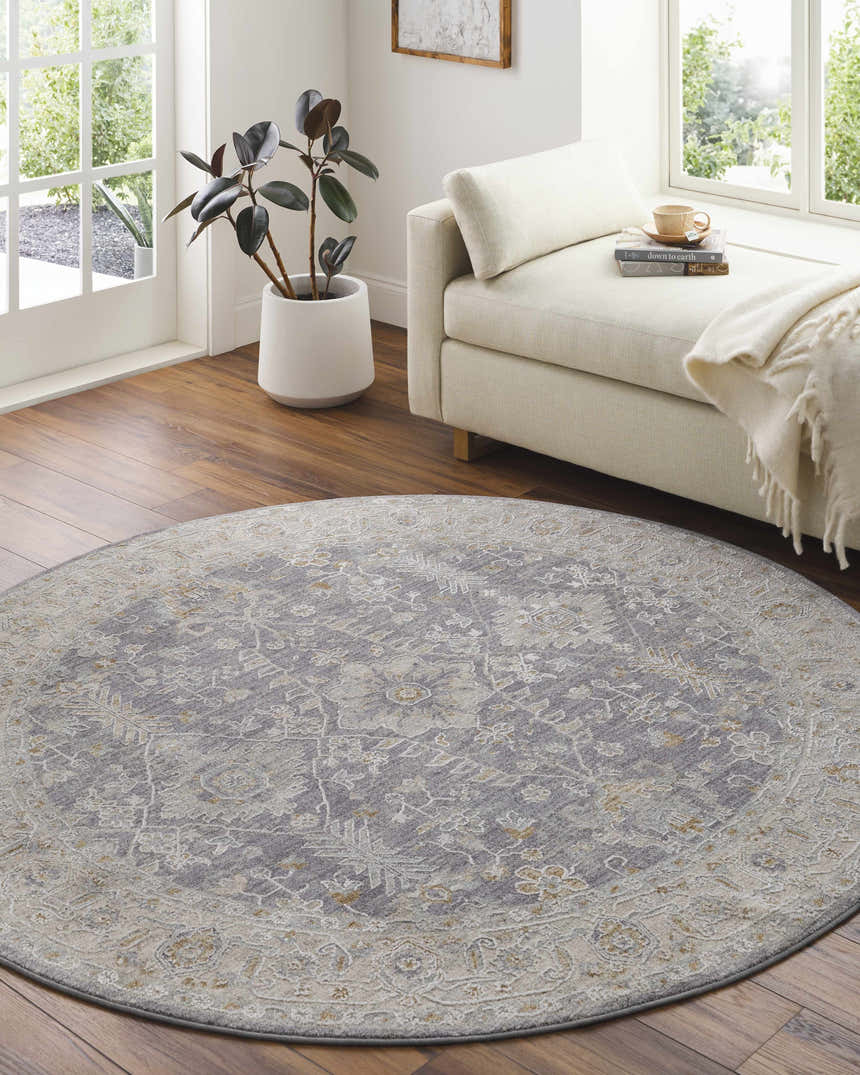 Light-filled sunroom with a round Dalupirip rug in gray, beige, and brown, styled with a daybed and potted plant. Roomscene-Round