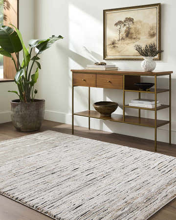 Living room scene with a tan console table and the Wantu Luxe Thick Area Rug in black, tan, and ivory. Roomscene-Rectangle