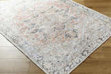 Close-up of the Aethwy Washable Area Rug. Farmhouse style rug in light silver, prairie dust, and silver gray on wood floor. Corner