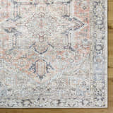Close-up of the Aethwy Washable Area Rug. Farmhouse style rug in light silver, prairie dust, silver gray, slate blue, and warm gray. Swatch