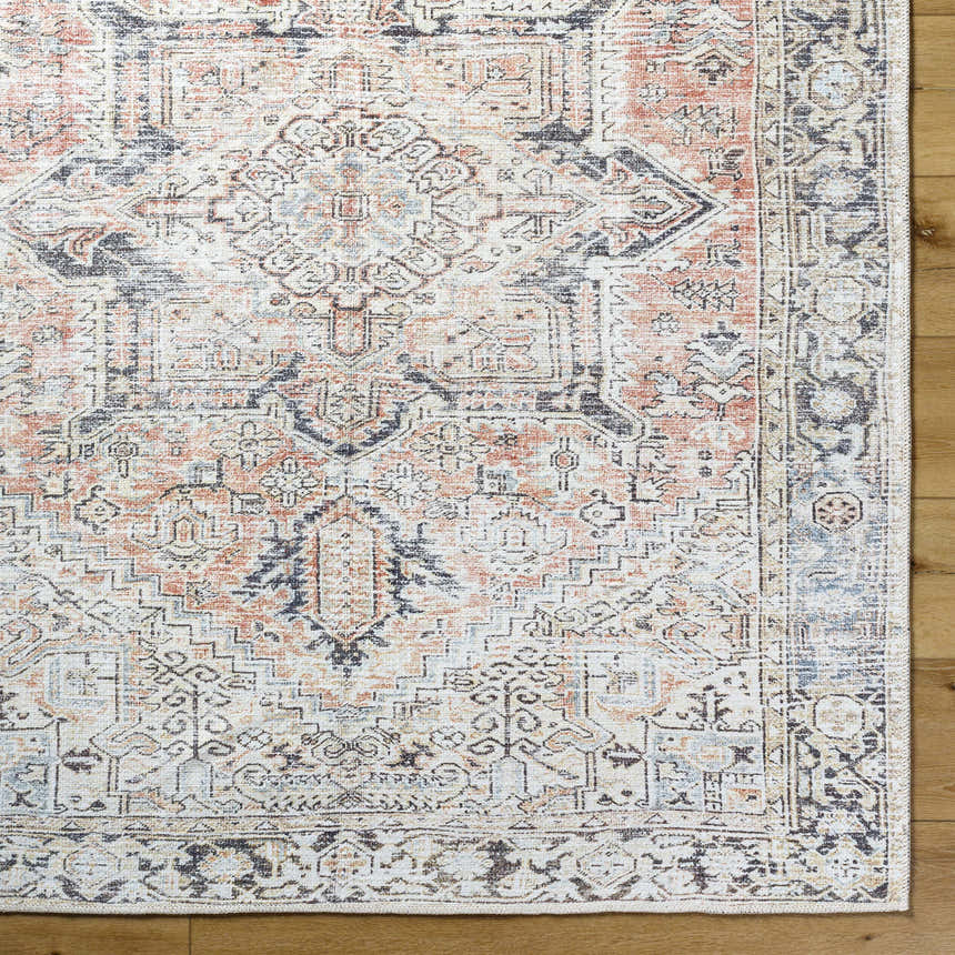 Close-up of the Aethwy Washable Area Rug. Farmhouse style rug in light silver, prairie dust, silver gray, slate blue, and warm gray. Swatch