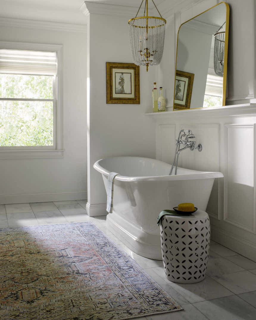 Farmhouse bathroom with white tub and Aethwy Washable Area Rug in light silver, prairie dust, and slate blue. Roomscene-Rectangle