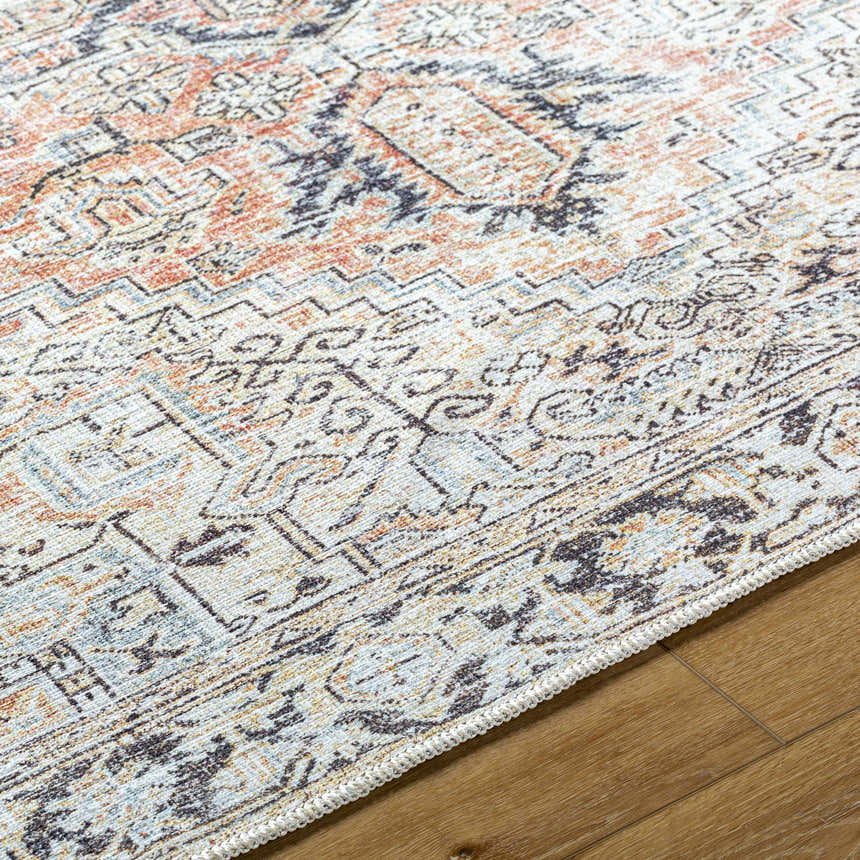 Close-up of the Aethwy Washable Area Rug. Farmhouse style rug with light silver, prairie dust, and slate blue tones. Texture