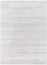 Close-up of the Arlind Area Rug. The shag rug has a soft, plush texture in medium gray and white hues. Design-Rectangle-537