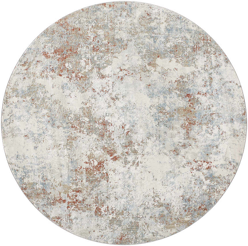 Close-up of round Dinos Thick Luxe Rug. Abstract design in dark gray, light gray, nutmeg, and blue hues. Contemporary style. Design-Round-67