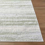 Close-up of the Asmara Green Area Rug showing its ash, light silver, and sage horizontal stripe pattern and soft texture. Front