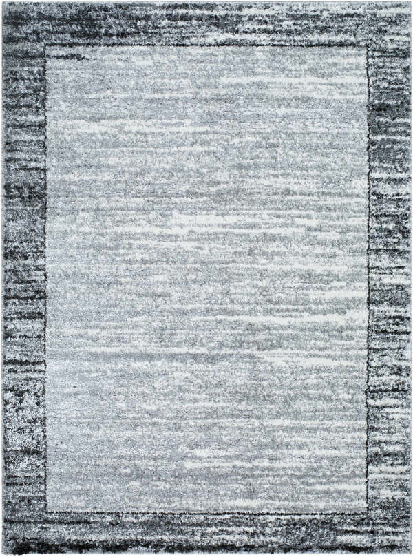 Close-up of the Dhaval Black Area Rug, showcasing its charcoal, light gray, and black hues and subtle textured pattern. Design-Rectangle-5373
