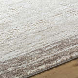 Close-up of the Dhaval Ivory Area Rug showing its cream, ivory, and light brown textured design. Texture