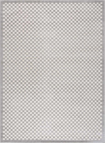 Close-up of Gaiwan Cream Gray Washable Area Rug featuring a small checkerboard pattern in light gray and off-white. Design-Rectangle