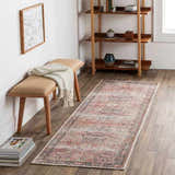 Entryway scene with a pink and blue Dunsha Boutique Washable Area Rug, bench, and wood shelving. Roomscene-Runner