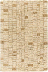 Close-up of the Anusha Area Rug. Hand-tufted wool rug in beige and tan with a subtle geometric pattern. Soft, textured surface. Design-Rectangle-576