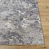Close-up of the Aolani Medium Gray Area Rug showing its Southwestern-style pattern and textured weave. Front
