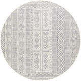 Close-up of the Epson Indoor & Outdoor Rug in a round shape. The rug has a bohemian geometric pattern in off white and navy. Design-Round-710