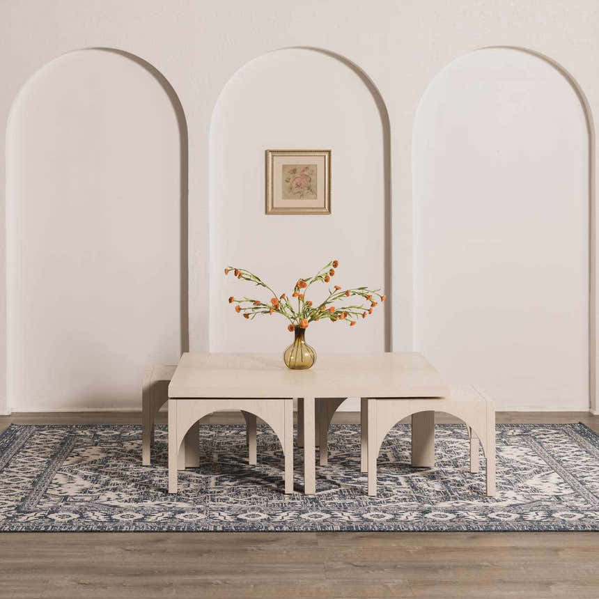 Dining room scene with a navy blue Etoile rug, light wood table, benches, and arched wall details. Roomscene-Rectangle