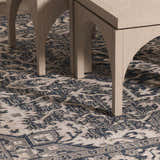 Close-up of the Etoile Navy Blue Performance Rug with a detailed traditional pattern and light wood furniture legs. Roomscene-Rectangle