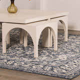 Close-up of the Etoile Navy Blue Performance Rug with a traditional pattern under a modern white coffee table. Roomscene-Rectangle