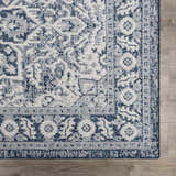 Close-up of the Etoile Navy Blue Performance Rug, showcasing its traditional, intricate blue and white pattern. Swatch