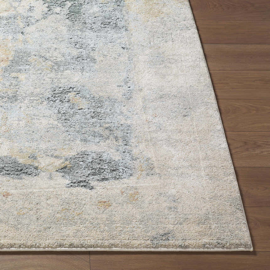 Close up of the Alanna Thick Luxe Area Rug showing beige, gray, and olive tones on a wood floor. Front