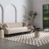 Living room scene with a brown and white checkered Keesa Area Rug, beige sofa, and modern decor. Roomscene-Rectangle