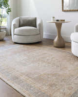 Living room scene with neutral swivel chairs and the Luciana Galey Alix x LIVABLISS GALU-2300 area rug in antique gold, charcoal, and rose. Roomscene-Rectangle