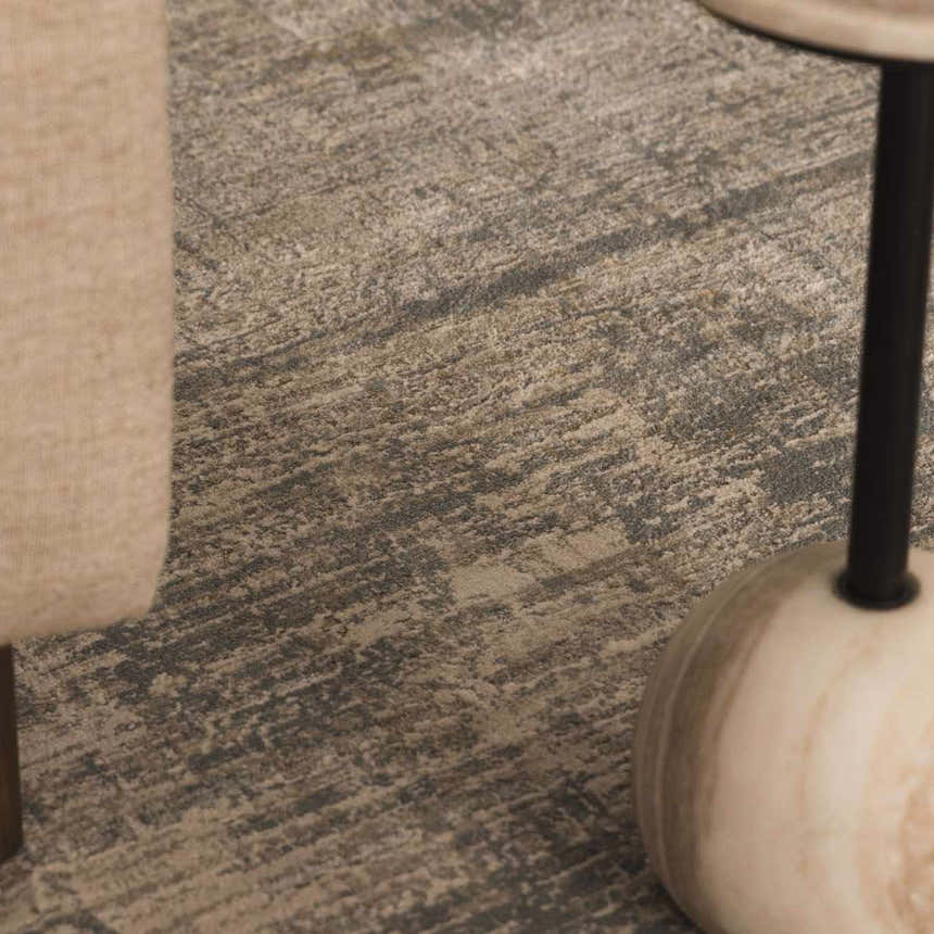 Close-up of the Fallin Gray Thick Luxe Abstract Striped Rug, showing its texture and dusty sage, light gray, and taupe colors. Styleshot