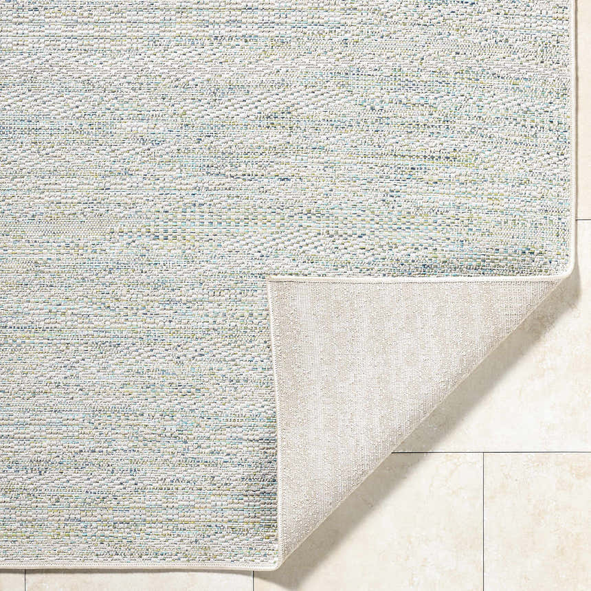 Close-up of the Alezae Ivory Area Rug showing its woven texture and ivory, light gray, and pale blue colors. Fold